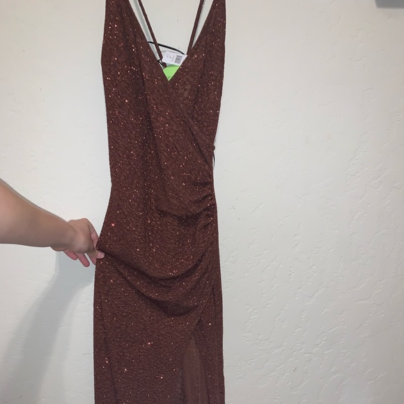 This is a brown/burgundy colored dress that has no holes or tears. So pretty! - Picture 2 of 5